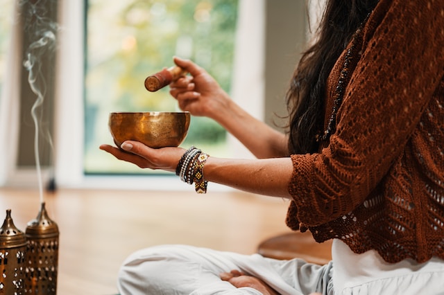 hands holding a meditation bowl